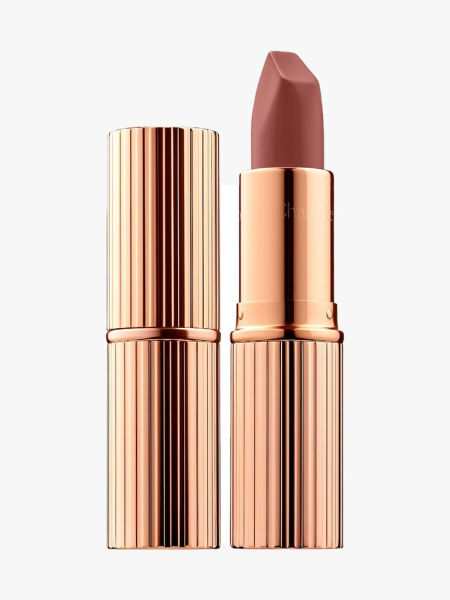 Charlotte Tilbury Matte Revolution Lipstick in Pillow Talk rose gold tube ridged of nude pink lipstick on light gray background